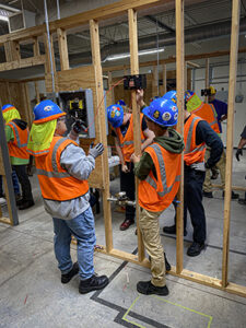 Photo: Minnesota Trades Academy interns work on a project at IBEW 110. 